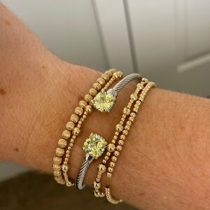 silver cable bracelet with peridot gems